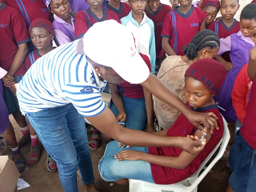 A child receives the HPV vaccination in Nigeria