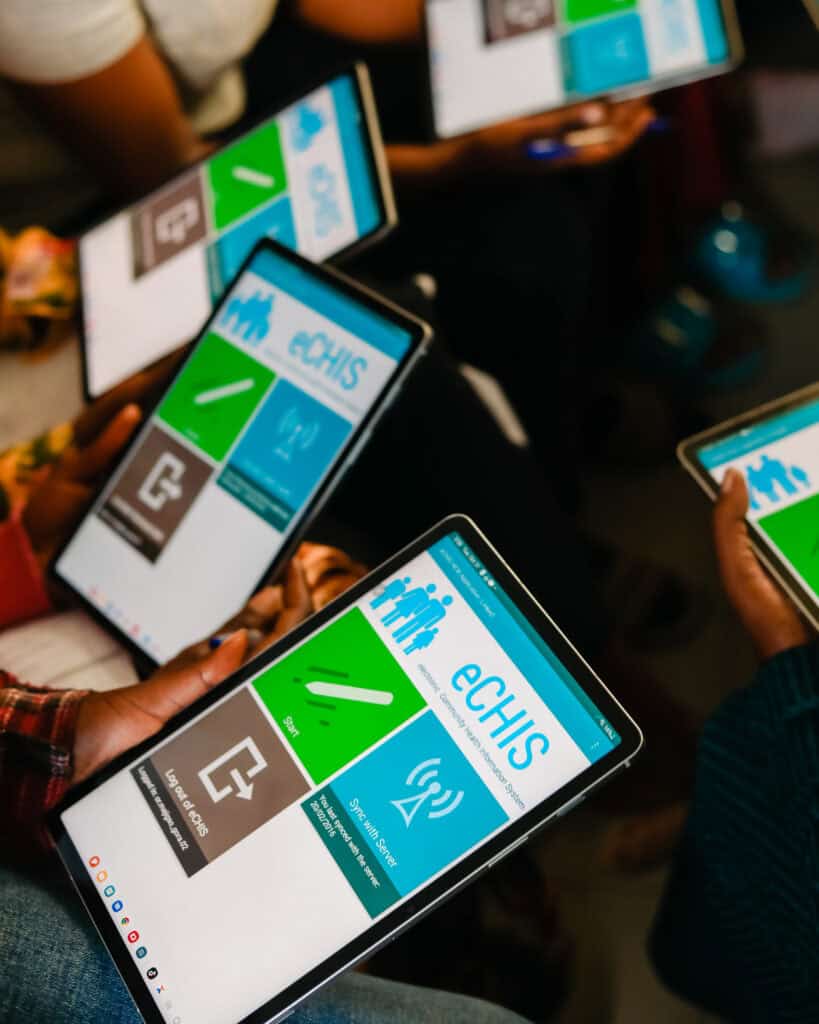 The eCHIS training system is shown on the screens of various tablets.