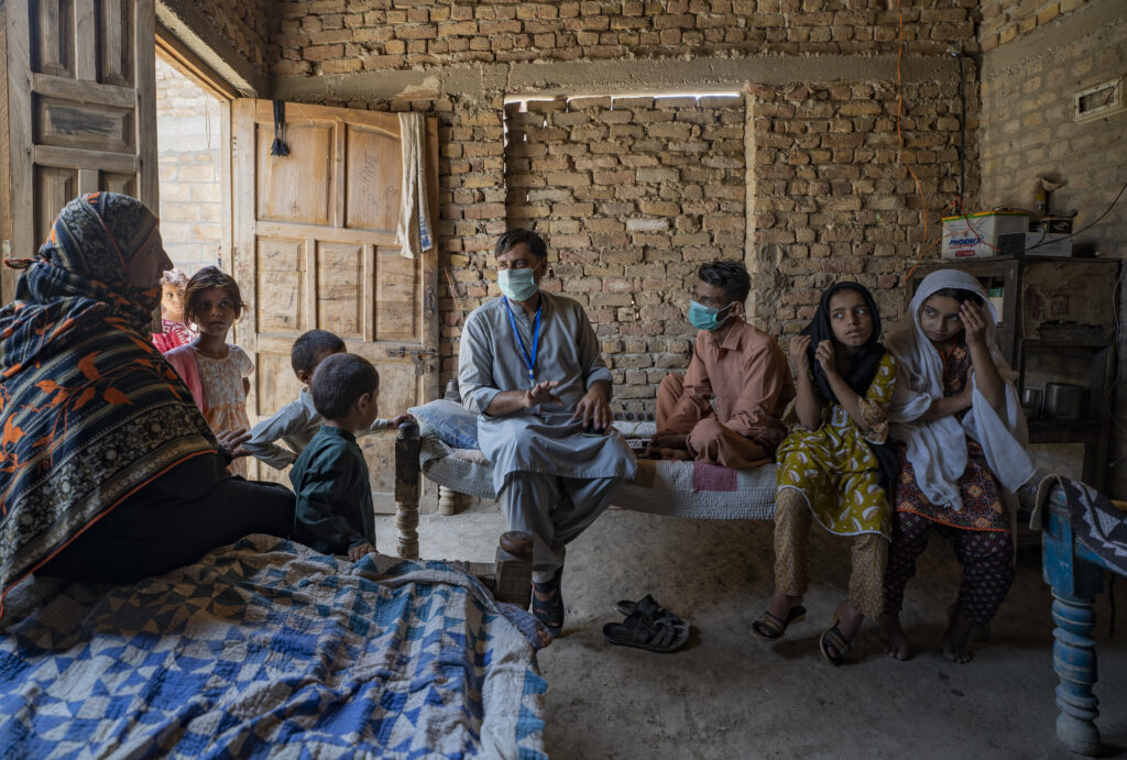 JSI staff counsels a family with known TB contact in their home in Sindh, Pakistan.