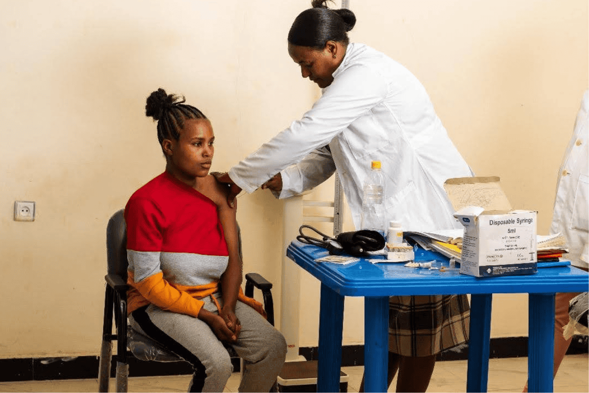 A client receiving health care services at the Bensa Ware comprehensive health post.