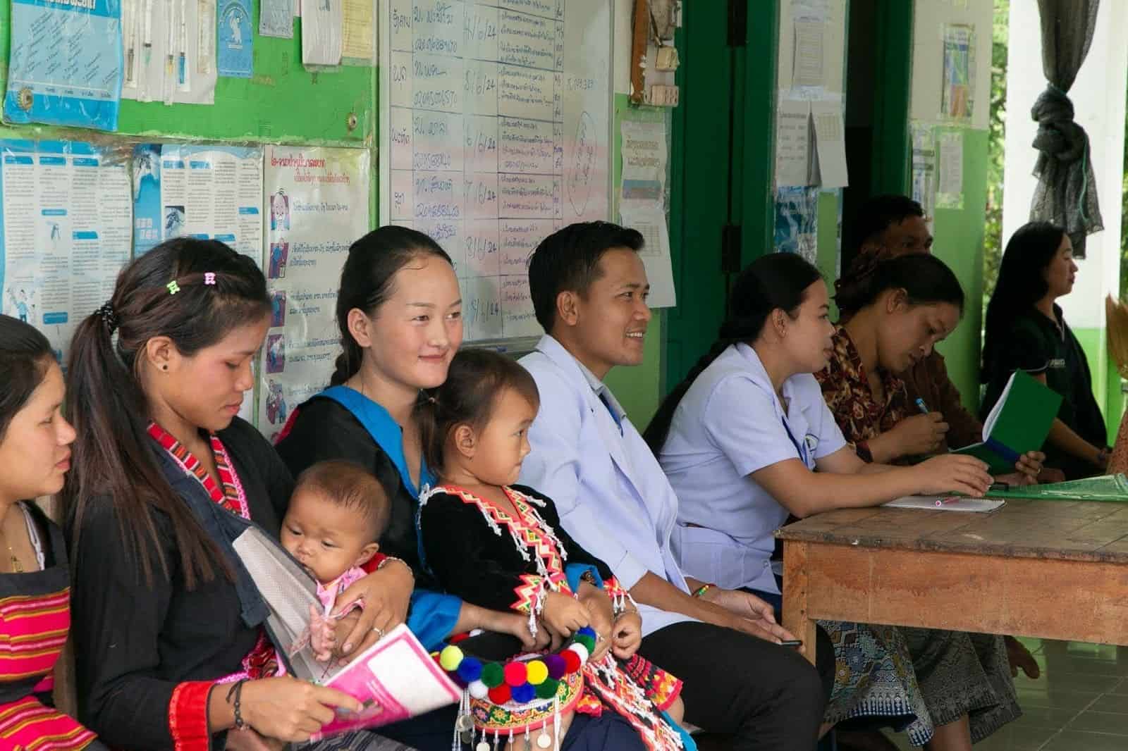 Clients engaging in child wellness visits at JSI-supported site in Oudomxay Province, Laos.