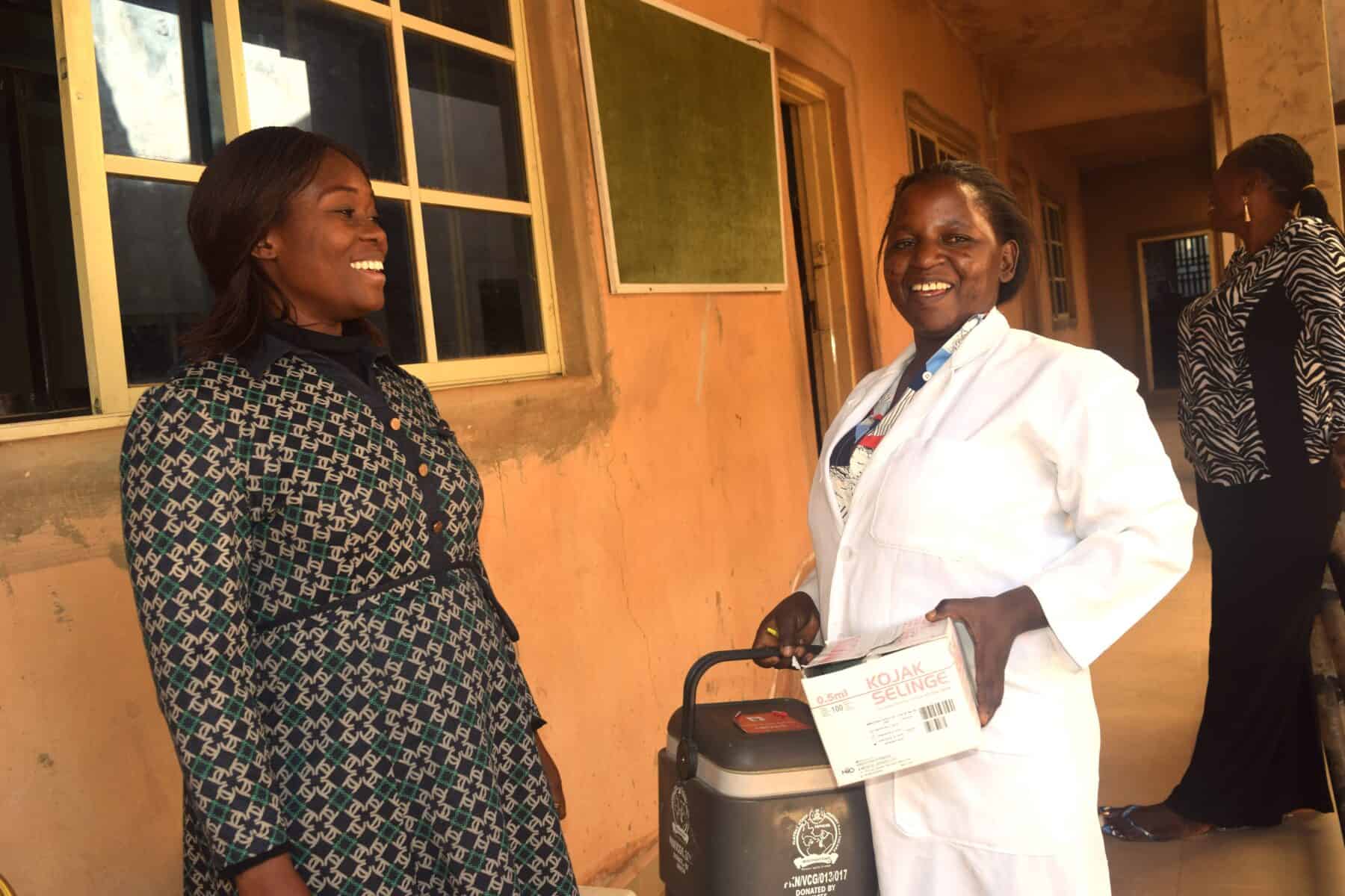 A school principal talks to a nurse