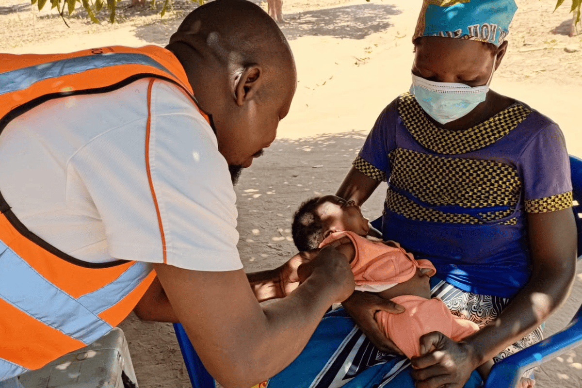 A woman brings her baby for vaccination at a health facility in Nampula Province, Mozambique.