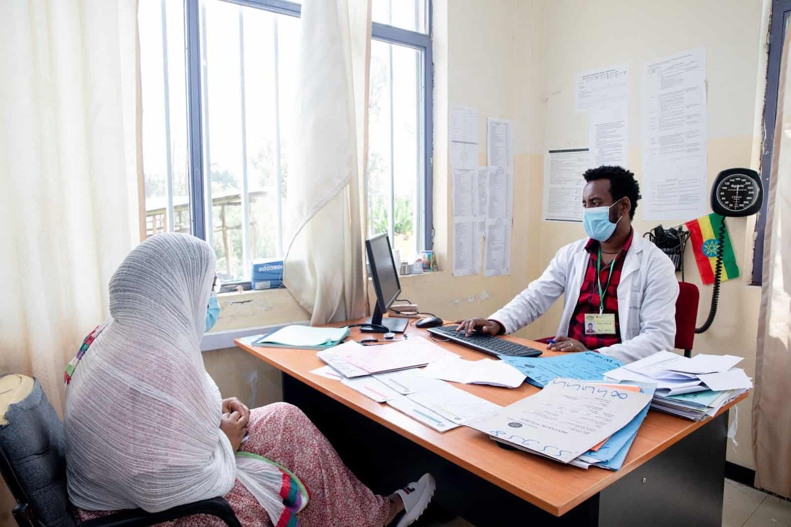 Clinician using the electronic medical records solution &ndash; a digital health record &ndash; at Ferensay Health Center.